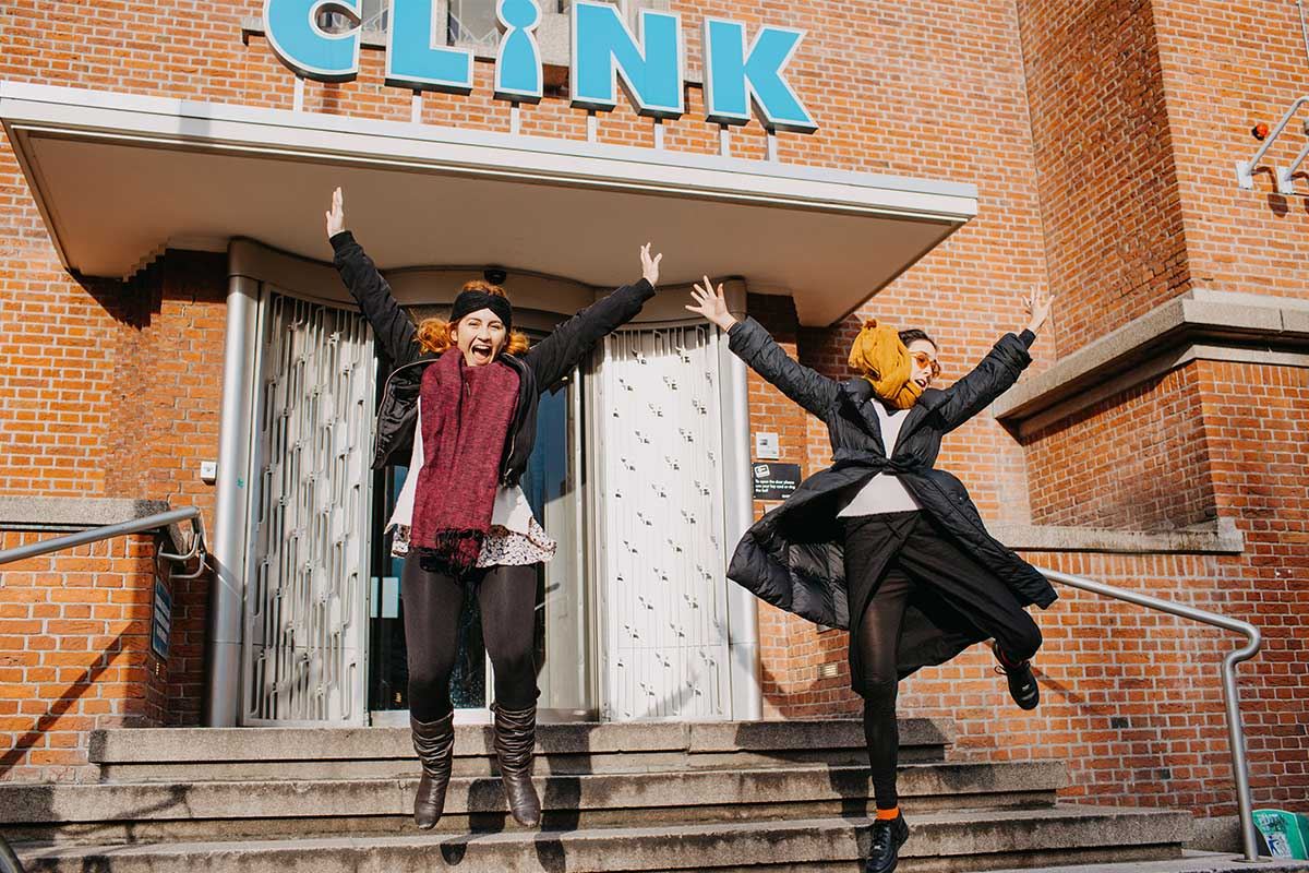 People jumping with joy as they arrive at ClinkNOORD hostel in Amsterdam