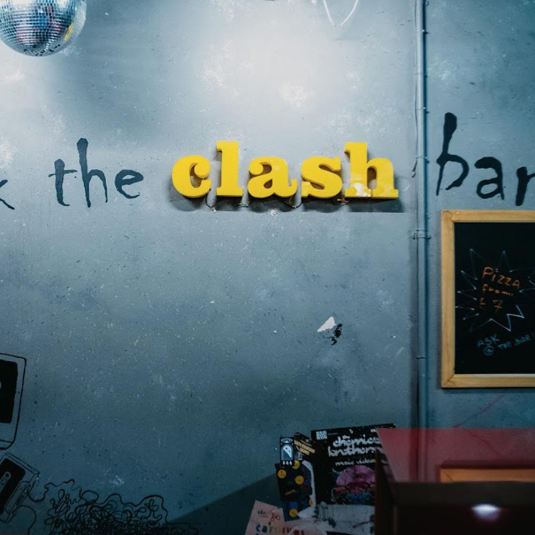 The Clash Bar wall signage at Clink 78 Hostel in London