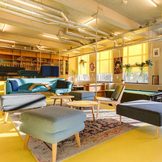 a social area with seating in ClinkNOORD hostel in Amsterdam