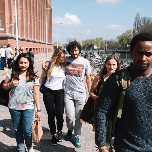 Groups in Amsterdam outside Clink noord hostel