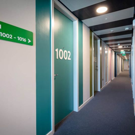 Clink i Lar hostel corridor and room signs