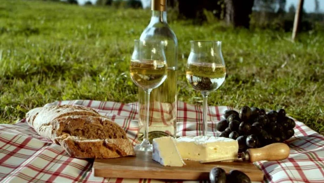 picnic in london with wine, fruit and cheese
