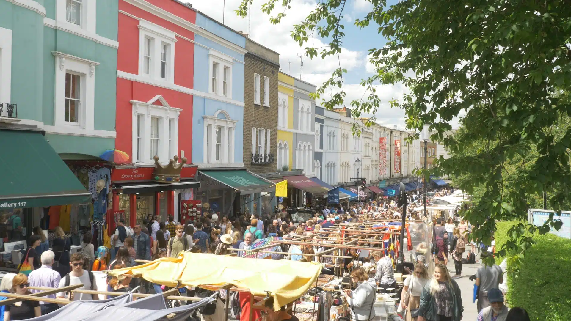 Busy crowds at Portobello Market located in Notting Hill, London 