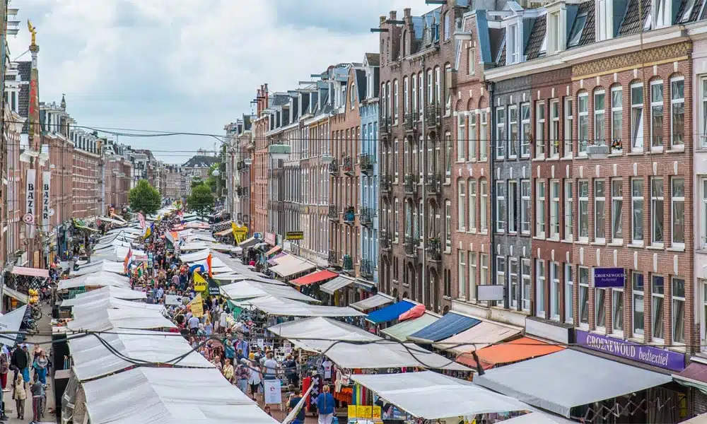an outdoor market in the city of amsterdam
