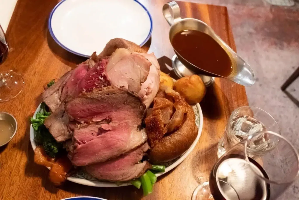 Large plate of Sunday dinner and gravy at Blacklock Shoreditch