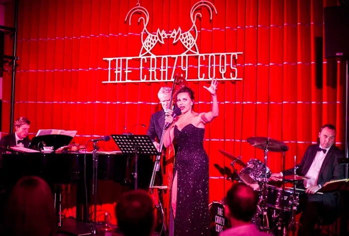 Singer on stage at The Crazy Coqs at Brasserie Zedel