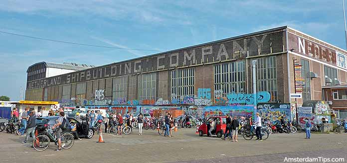 Outside looking at IJ-Hallen warehouse flea market building in Amsterdam’s Noord district