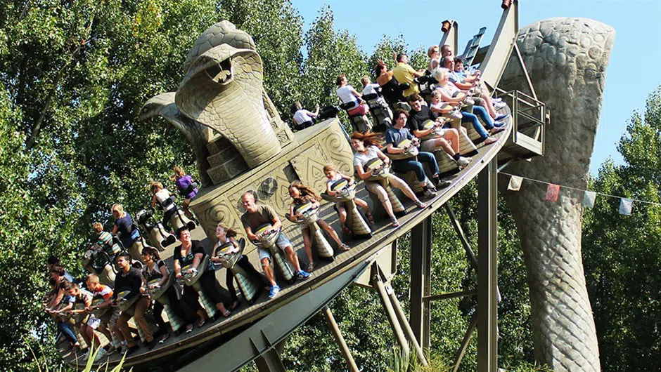 a group enjoys a rollercoaster in Chessington in London