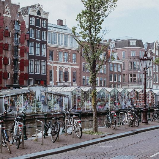 bicycles parked one of Amsterdam's famous canals